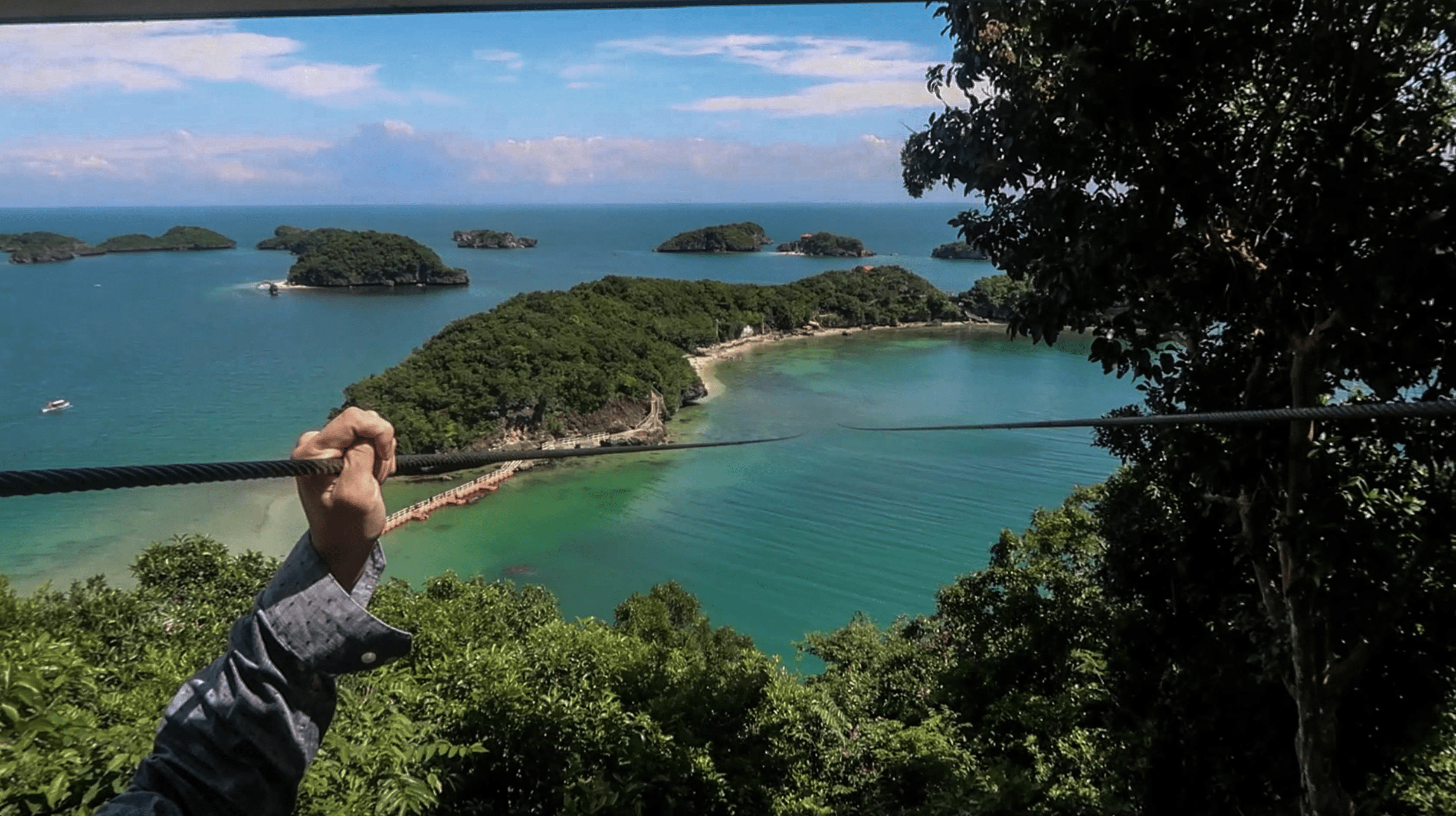 lennythroughpardise touching rope of zip-line at hundred islands pangasinan philippines